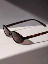 Lunettes de mode classique en plastique ovale à motif léopard pour femmes L’Art des Vêtements